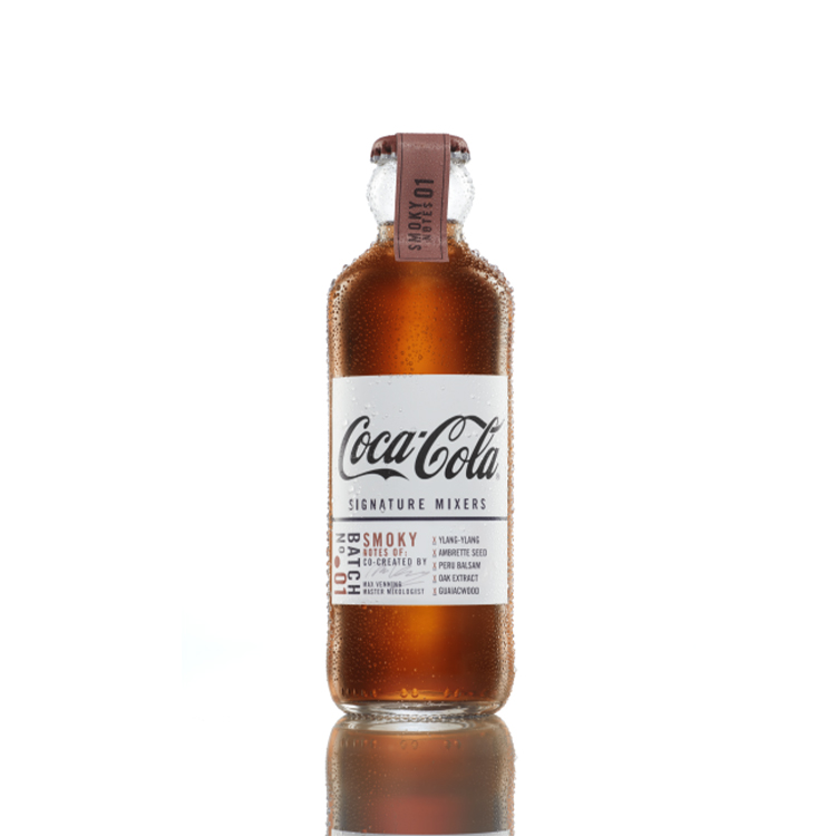 Coca-Cola Signature Mixers Smoky Notes bottle on white background.