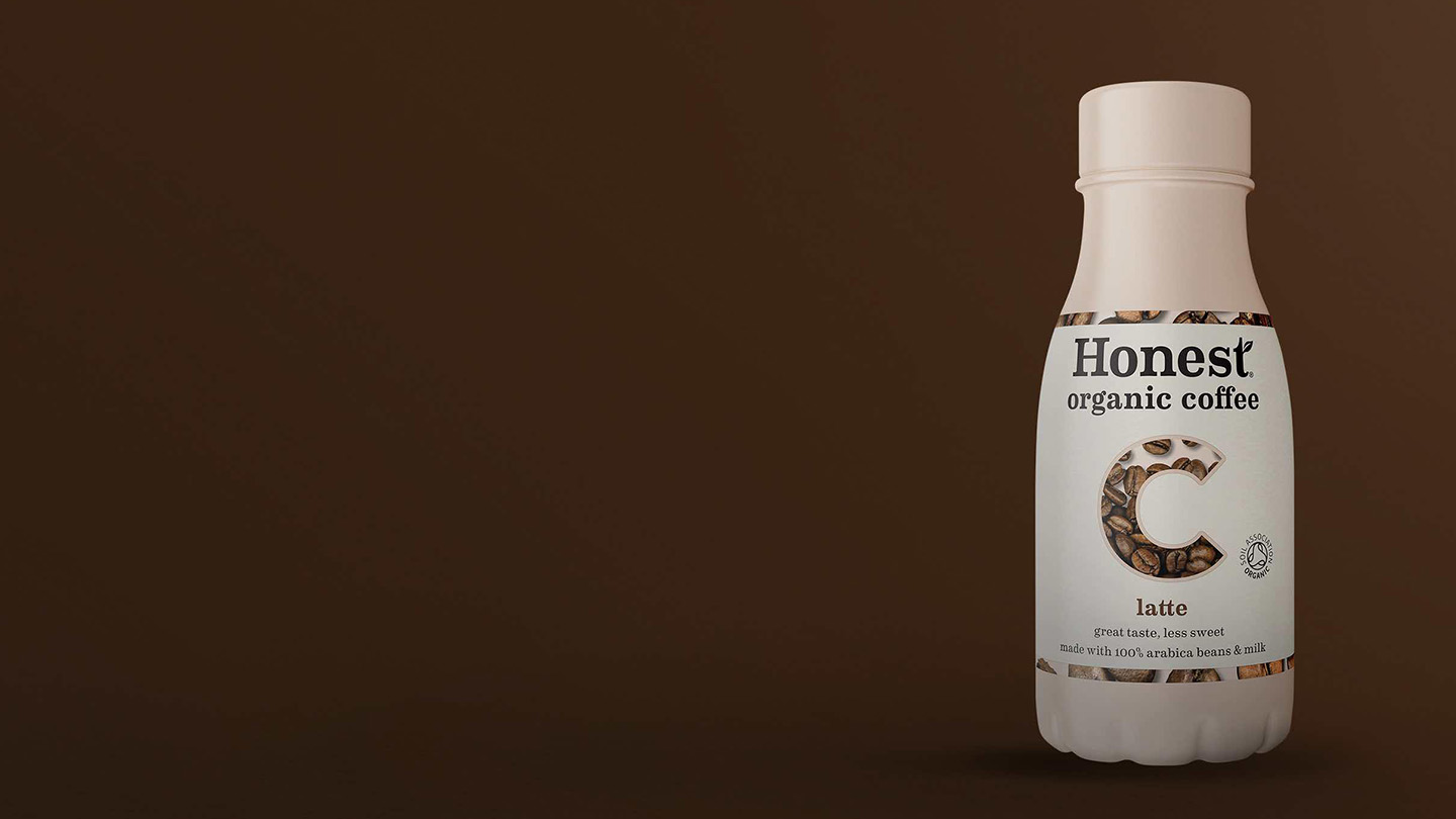 Honest Organic bottle on brown background.